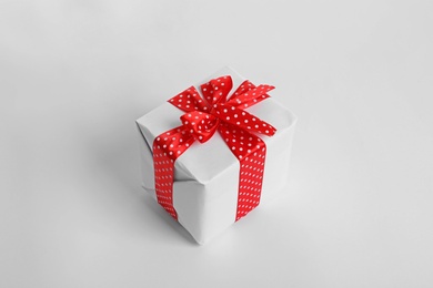 Photo of Beautifully wrapped gift box on white background