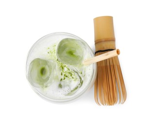 Photo of Glass of tasty iced matcha latte and bamboo whisk isolated on white, top view