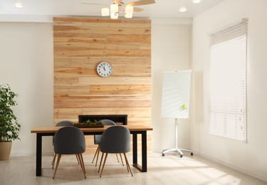 Modern meeting room interior with large table and chairs