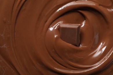 Photo of Tasty milk chocolate paste and piece as background, top view