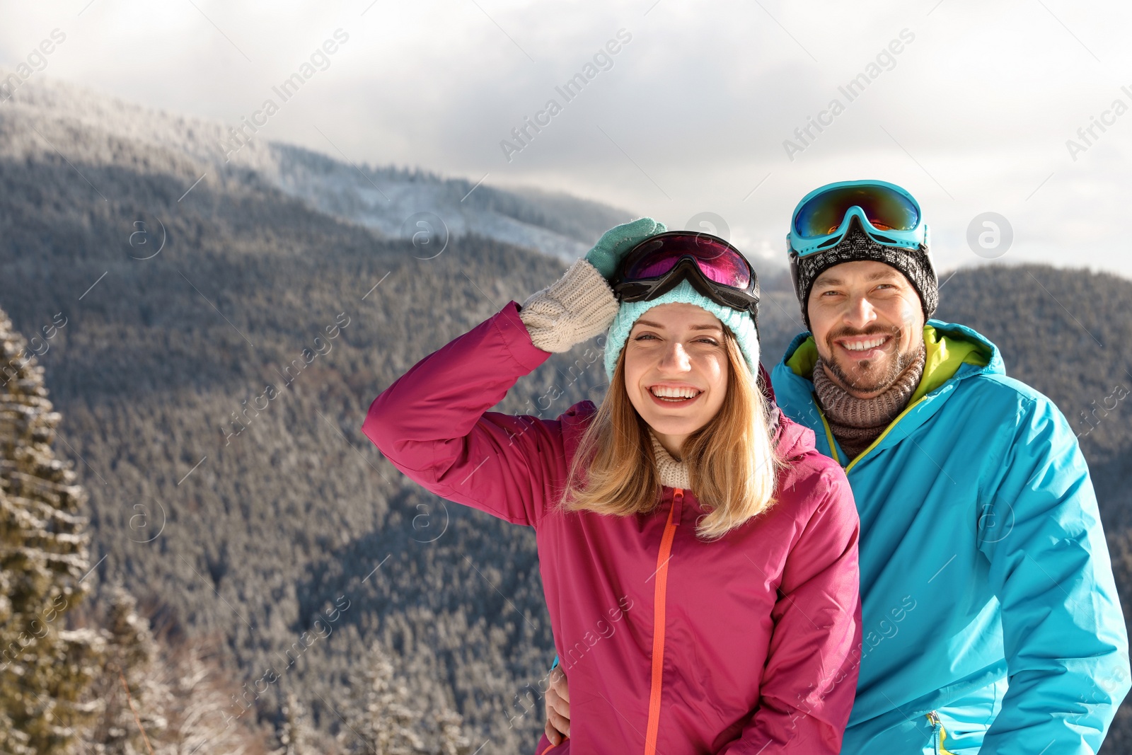 Photo of Happy couple spending winter vacation in mountains