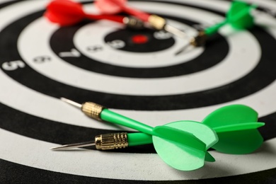 Photo of Green arrows on dart board, closeup view