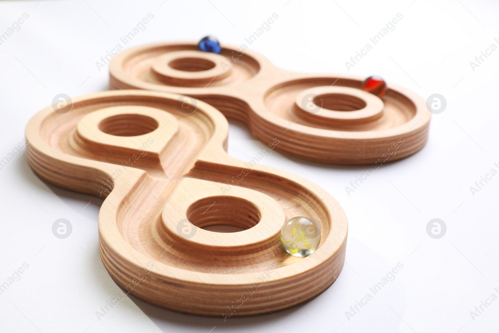 Photo of Labyrinth balance boards on white background, closeup. Montessori toy