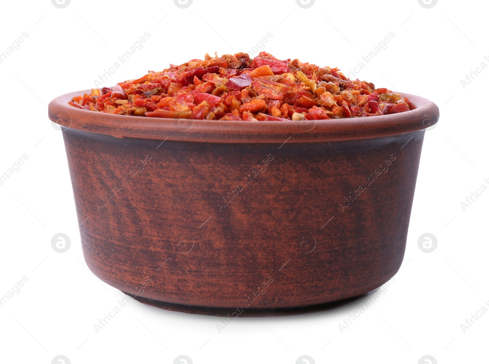 Photo of Aromatic spice. Red chili pepper flakes in bowl isolated on white