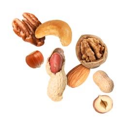 Many different nuts in air on white background