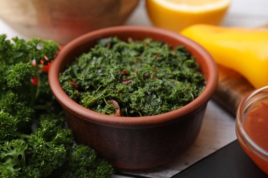 Photo of Fresh marinade in bowl on white table, closeup