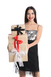 Photo of Woman in party dress holding Christmas gifts on white background