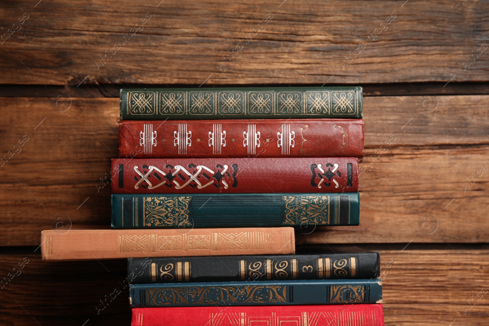 Photo of Collection of different books on wooden background