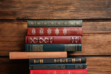 Photo of Collection of different books on wooden background