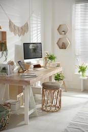 Stylish home office interior with comfortable workplace