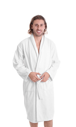 Young man in bathrobe on white background