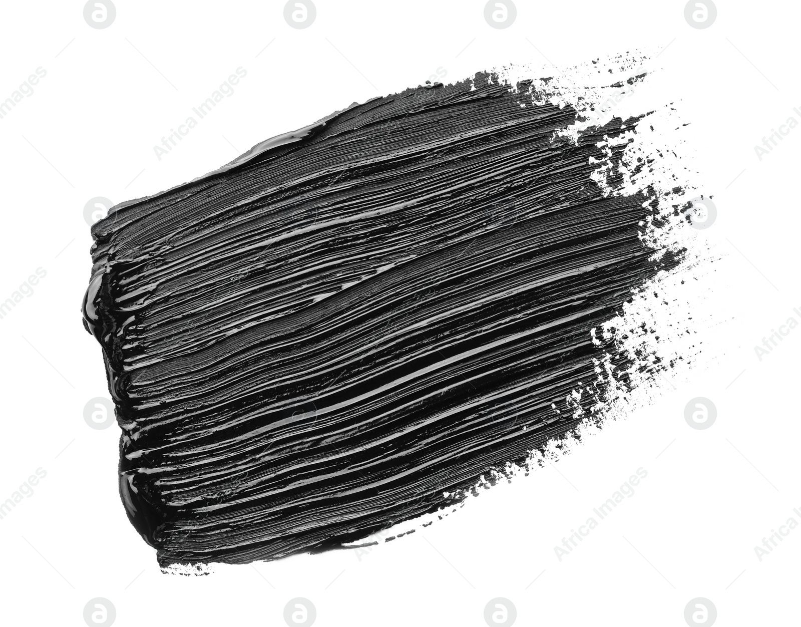 Photo of Brushstrokes of black oil paint on white background, top view