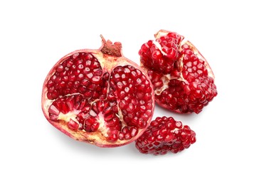 Photo of Fresh cut pomegranate isolated on white, top view