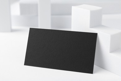 Photo of Blank black business card on white background. Mockup for design