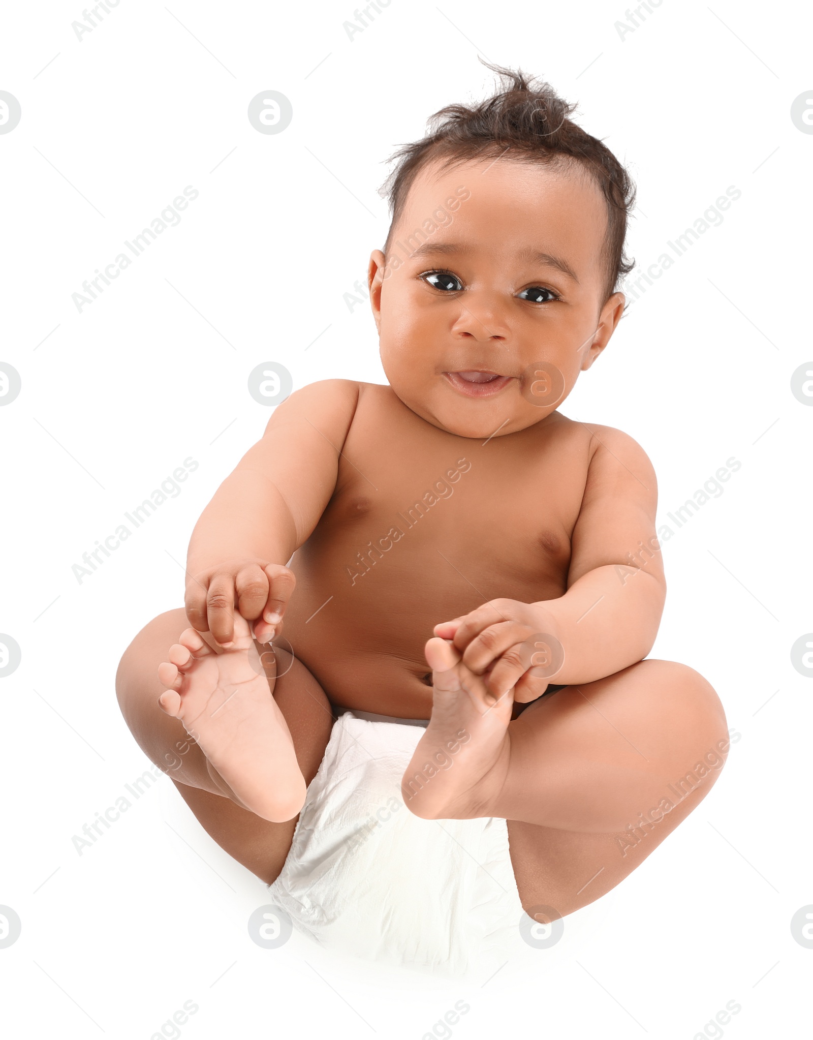 Photo of Adorable African-American baby in diaper on white background, top view