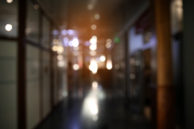 Photo of Blurred view of modern shopping mall interior