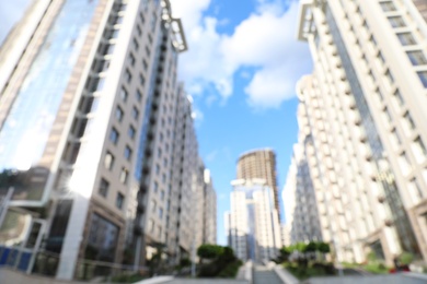 Photo of Blurred view of modern buildings in city