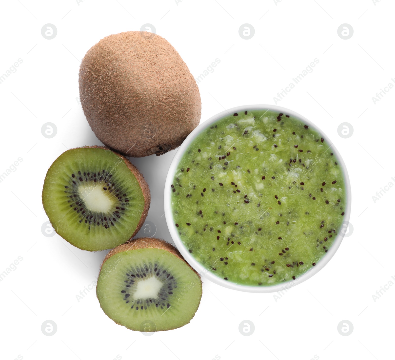 Photo of Kiwi puree in bowl and fresh fruits on white background, top view
