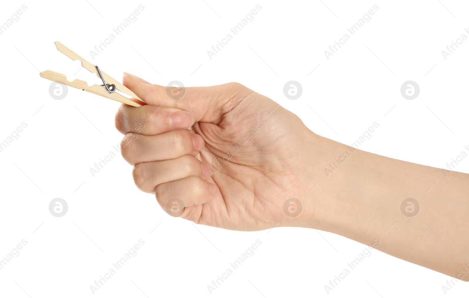 Photo of Woman holding wooden clothespin on white background, closeup