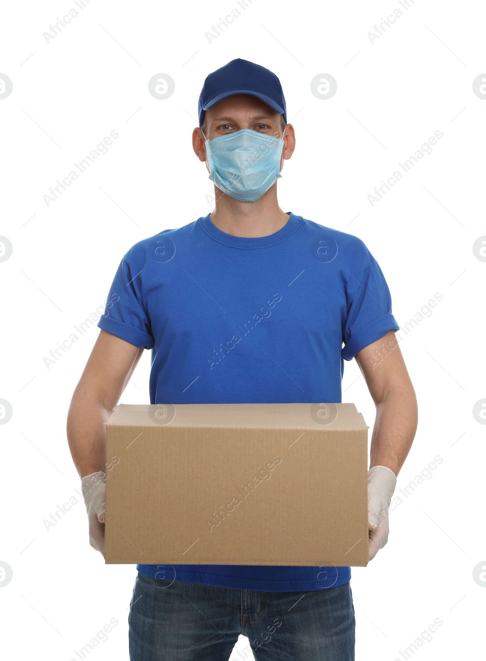 Photo of Courier in protective mask and gloves holding cardboard box on white background. Delivery service during coronavirus quarantine