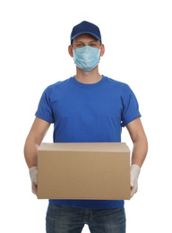 Courier in protective mask and gloves holding cardboard box on white background. Delivery service during coronavirus quarantine