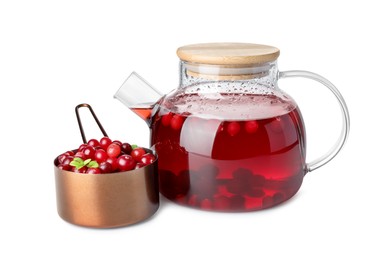 Photo of Tasty hot cranberry tea in teapot and scoop of fresh berries isolated on white