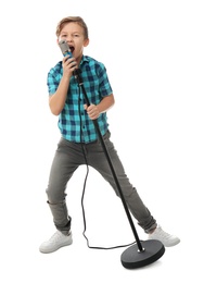 Cute boy singing in microphone on white background