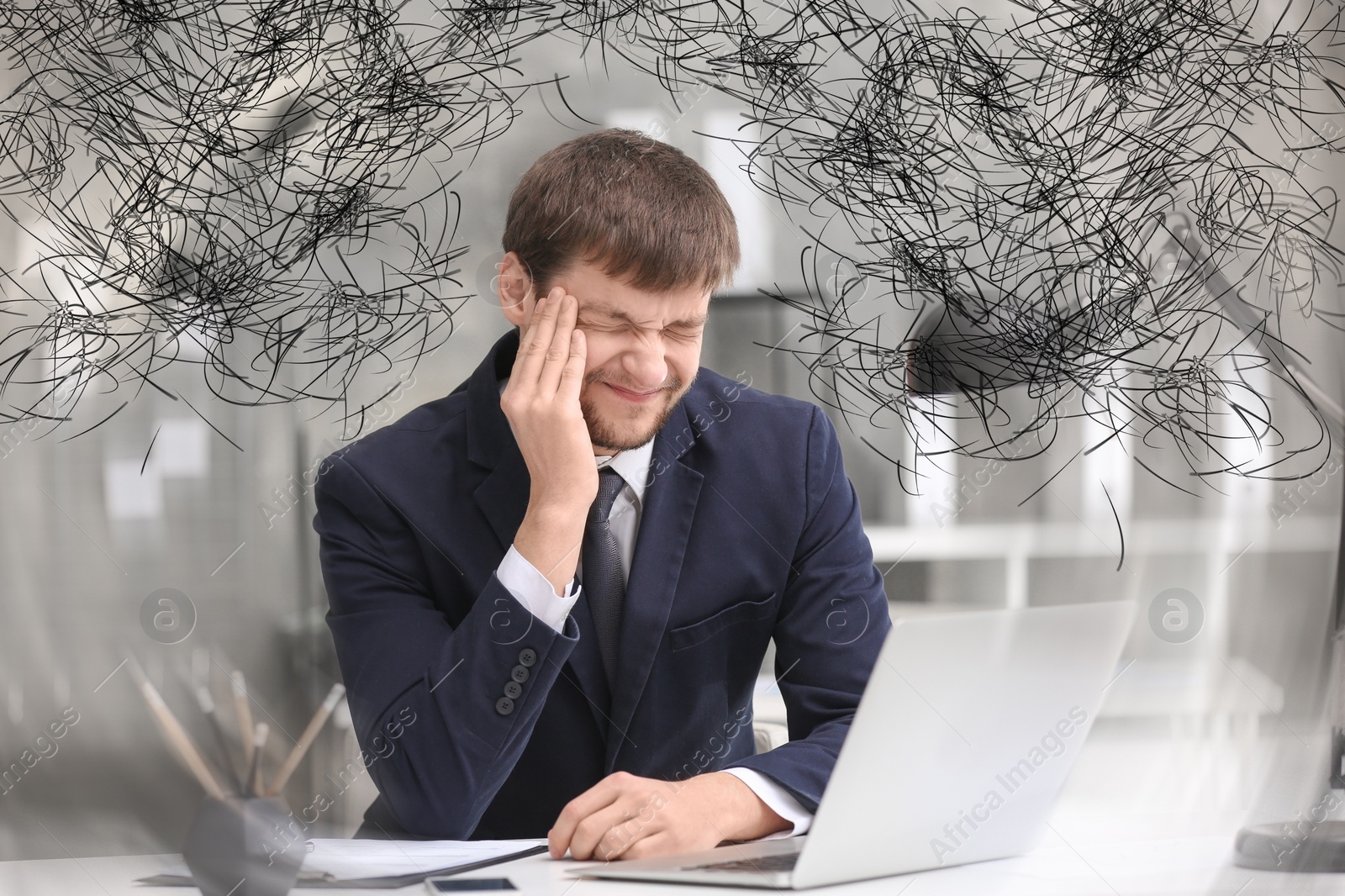 Image of Stressed man with mess in his head in office