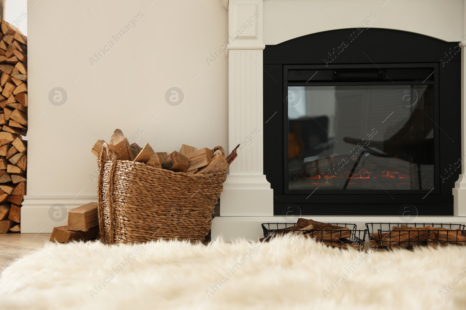 Photo of Basket with firewood on floor in room