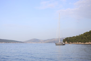 Photo of Beautiful view of tranquil sea and yacht on summer day