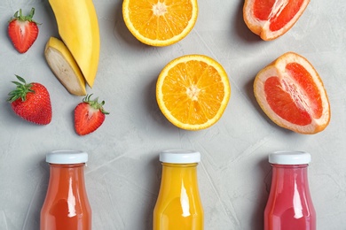Photo of Flat lay composition with tasty juices and ingredients on light background