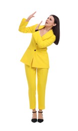 Photo of Beautiful businesswoman in yellow suit on white background