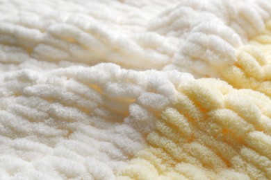 Photo of Texture of soft knitted fabric as background, closeup