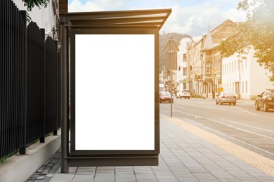 Photo of Advertising board on bus stop. Mockup for design