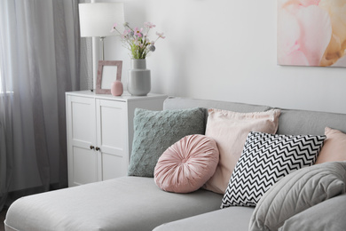 Photo of Elegant living room with comfortable sofa. Interior design