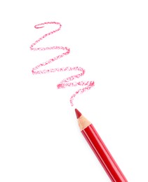 Photo of Bright lip liner stroke and pencil on white background, top view