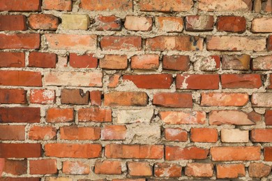 Photo of Texture of old red brick wall as background