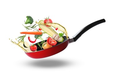 Image of Tasty fresh ingredients and frying pan on white background