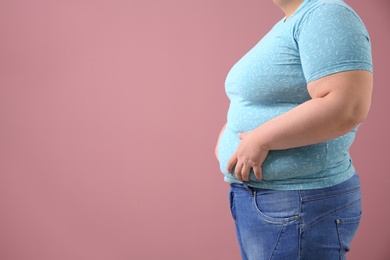 Photo of Overweight woman on color background