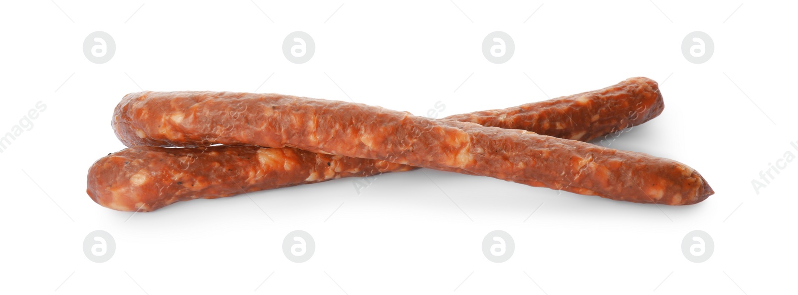 Photo of Thin dry smoked sausages isolated on white