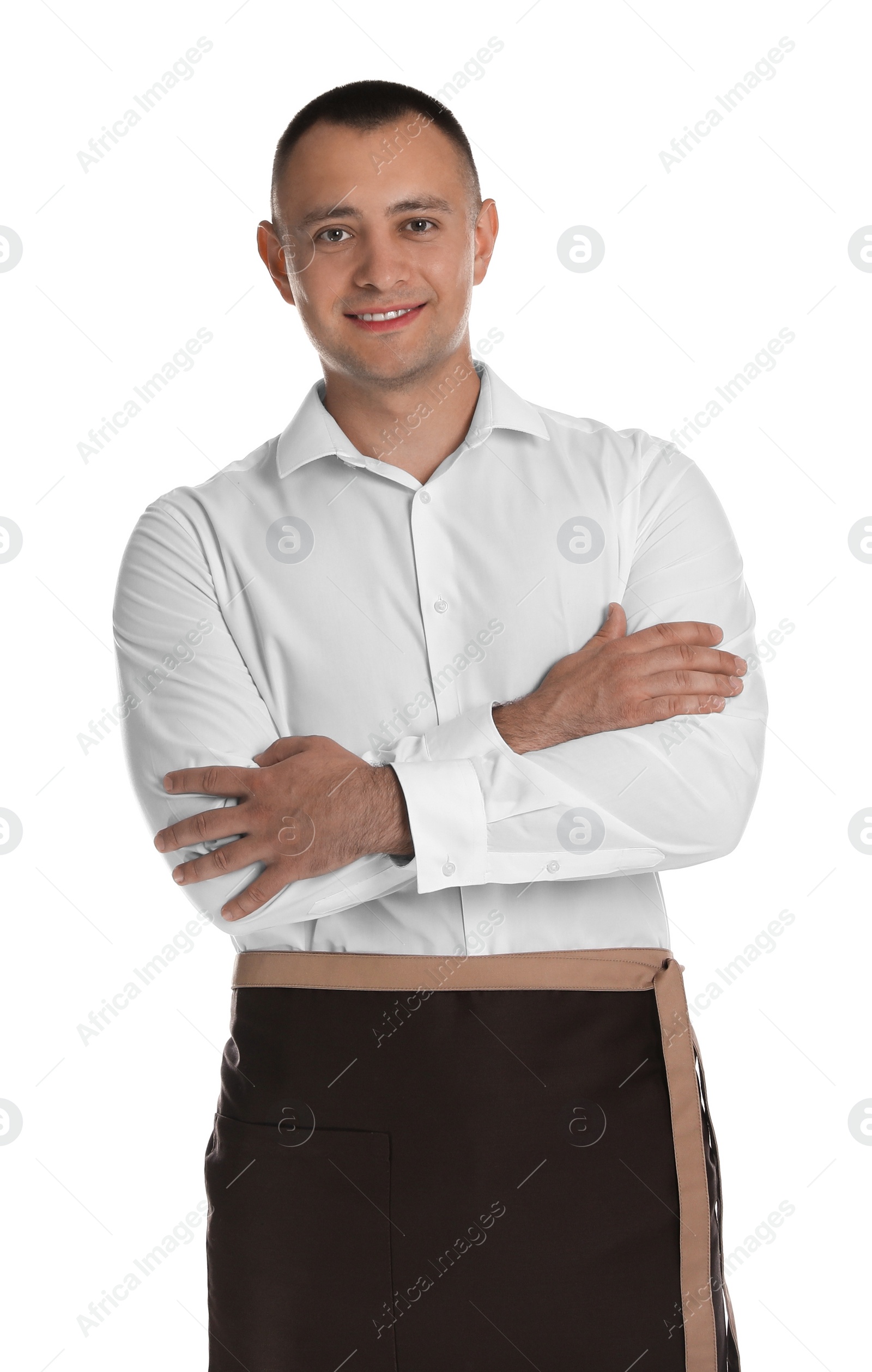 Photo of Portrait of happy young waiter in uniform on white background