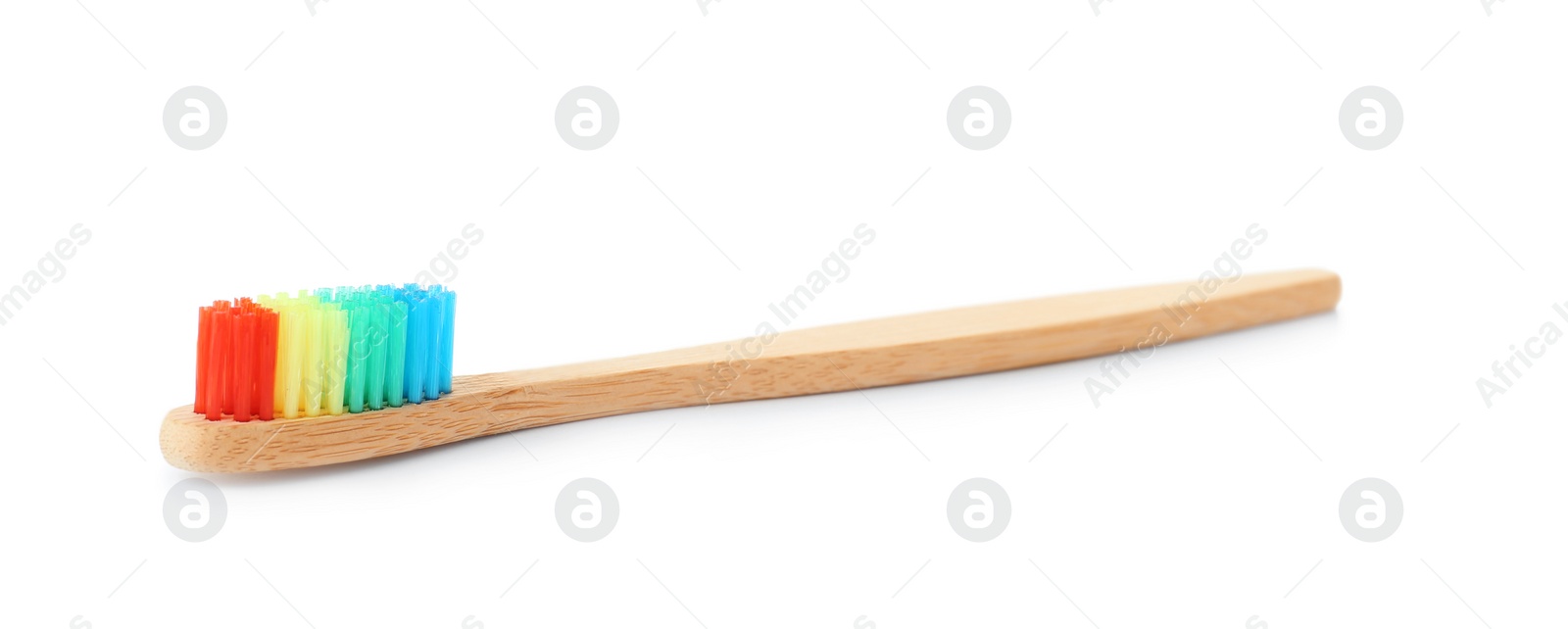 Photo of Bamboo toothbrush on white background. Dental care