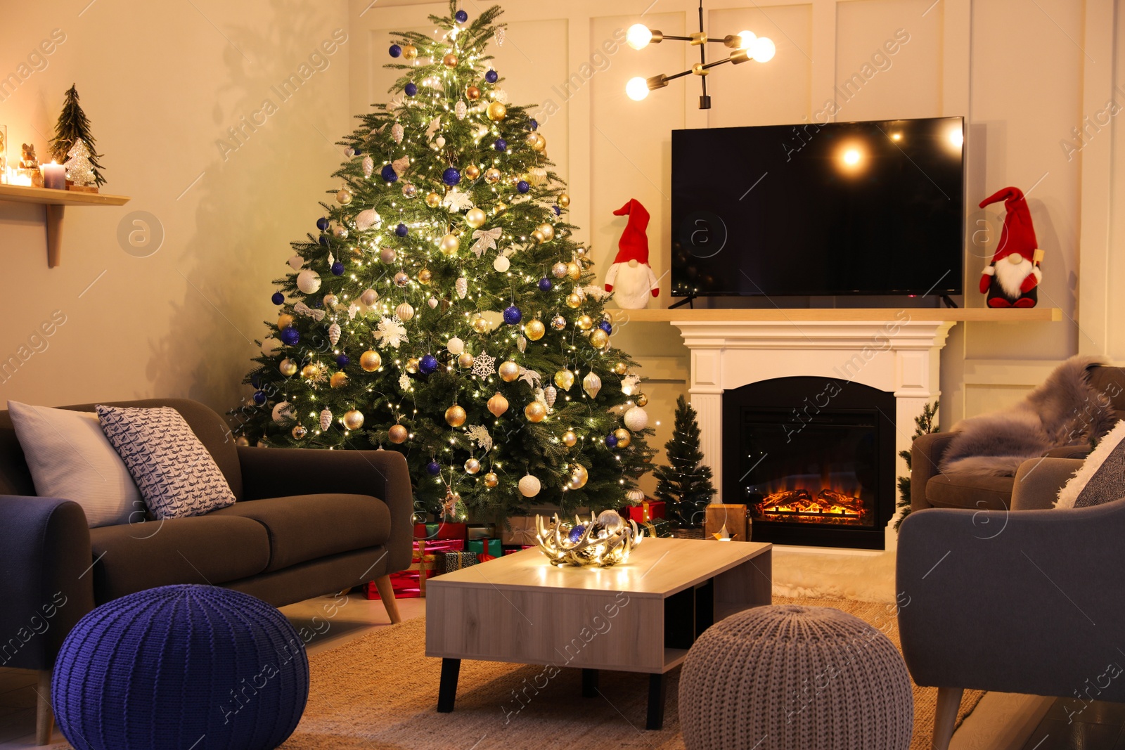 Photo of Cozy living room interior with beautiful Christmas tree near fireplace