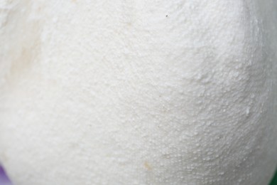 Delicious raw cottage cheese in cheesecloth as background, closeup