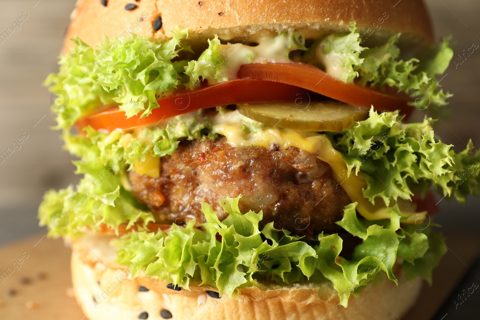 Burger with delicious patty on table, closeup Photo of Burger with delicious patty on table, closeup