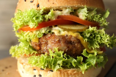 Photo of Burger with delicious patty on table, closeup