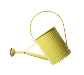 Yellow metal watering can isolated on white
