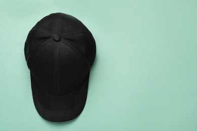 Photo of Baseball cap on light background, top view. Space for text