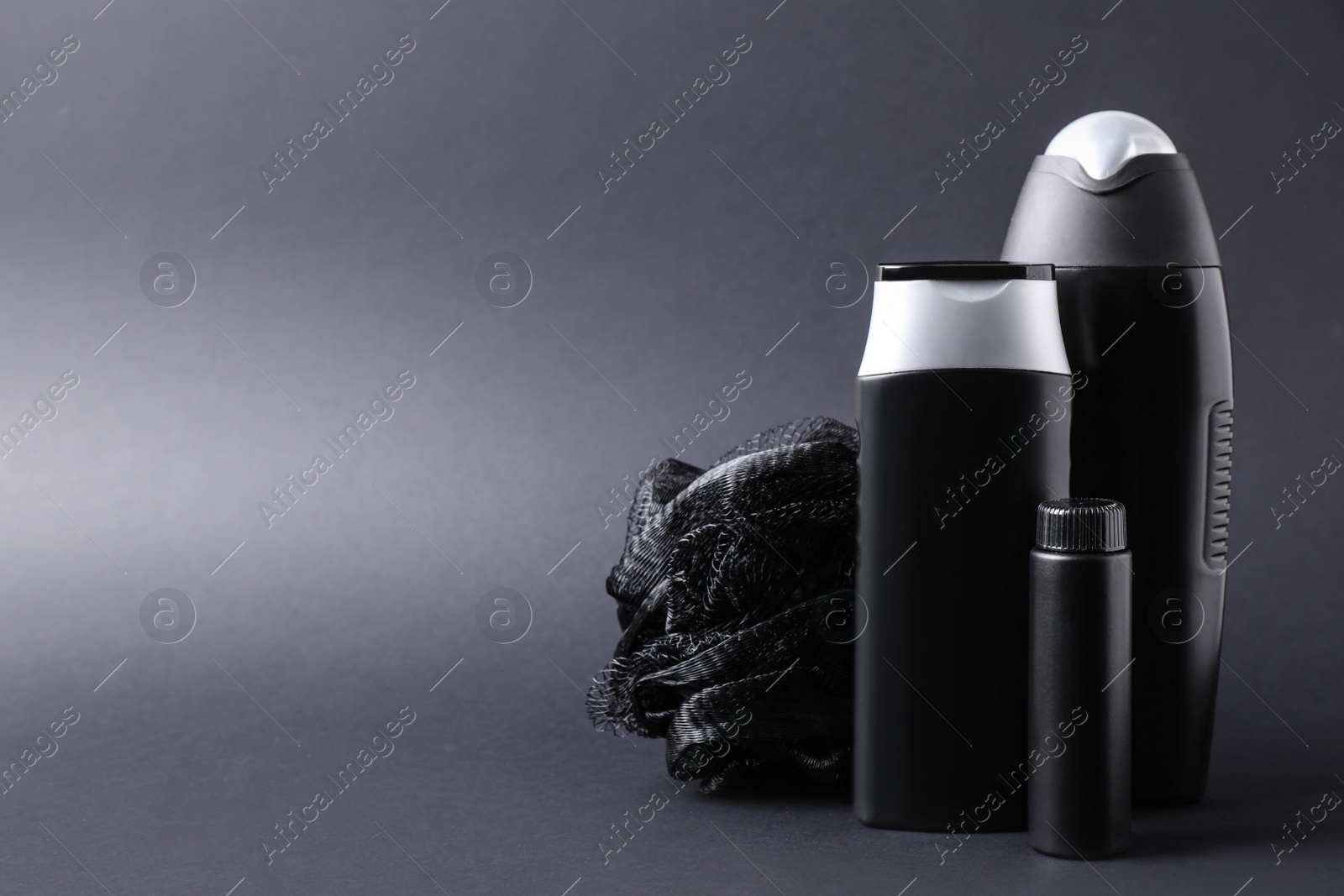 Photo of Set of different men's cosmetic products on black background. Space for text