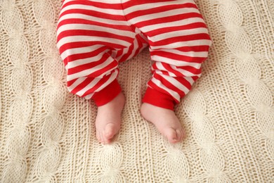 Photo of Cute little baby on blanket, top view